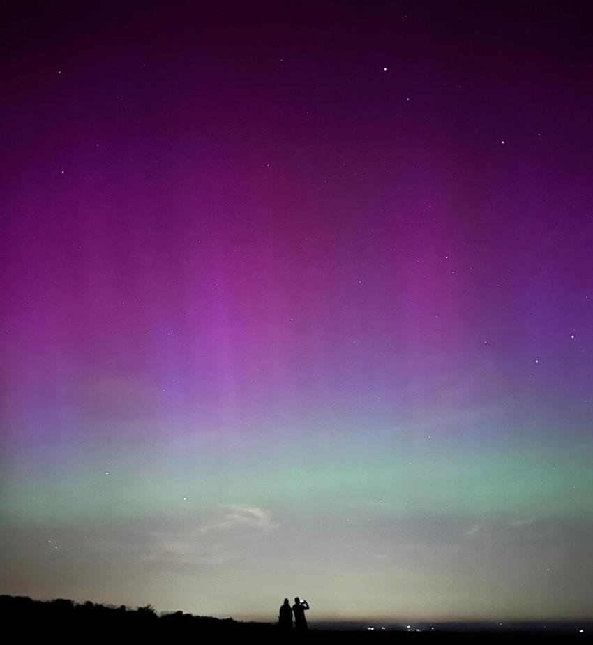Two stargazers from Lewes Astronomical Society are pictured watching the aurora above Lewes, East Sussex.