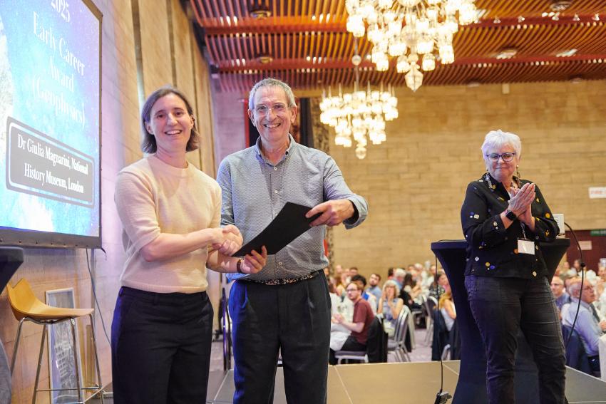 Dr Giulia Magnarini, of the Natural History Museum, London, receives the Early Career Award (G) from RAS president Professor Mike Lockwood.