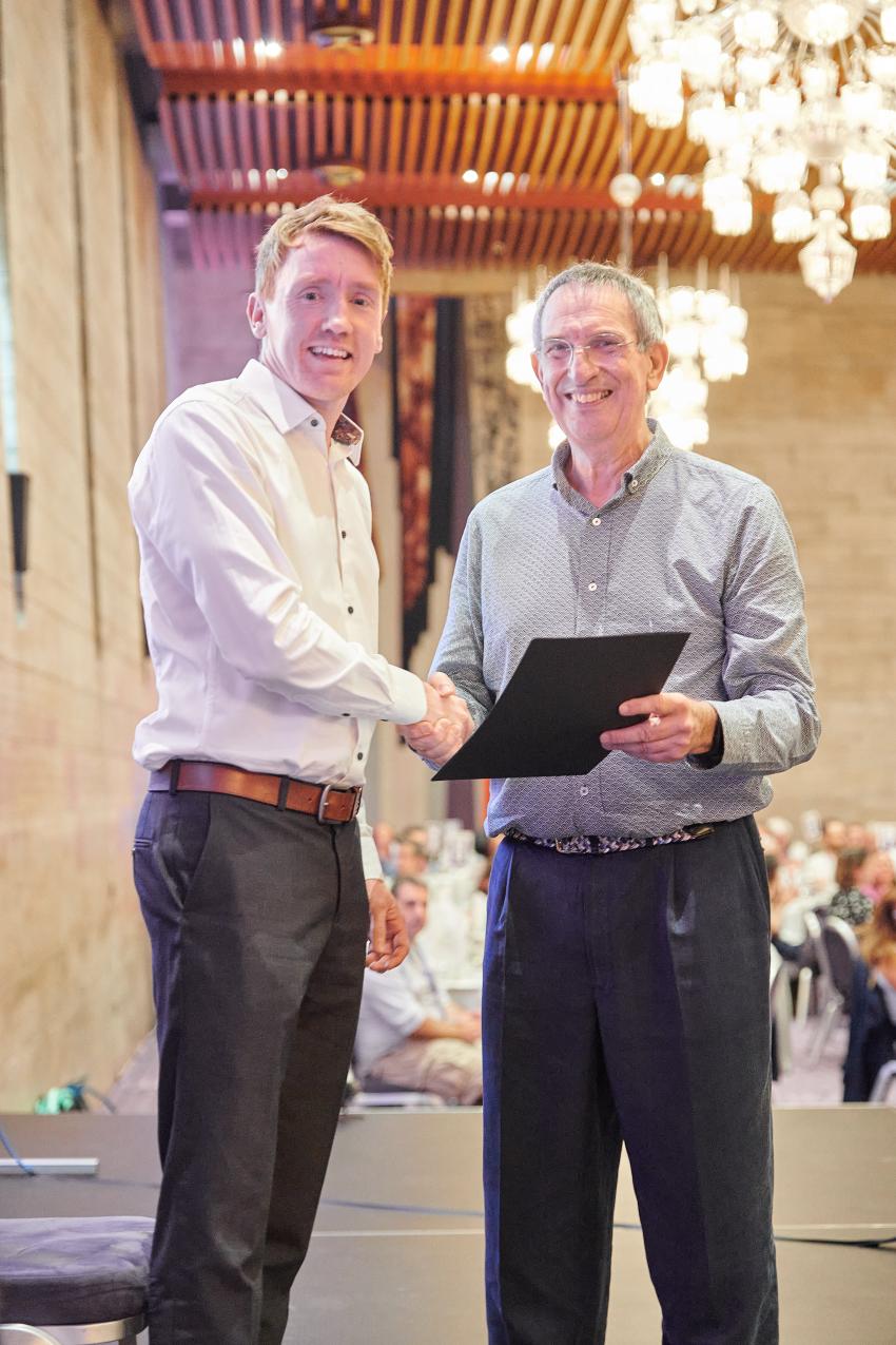 Dr Steve Cunnington, of the University of Portsmouth, receives the Early Career Award (A) from RAS president Professor Mike Lockwood.