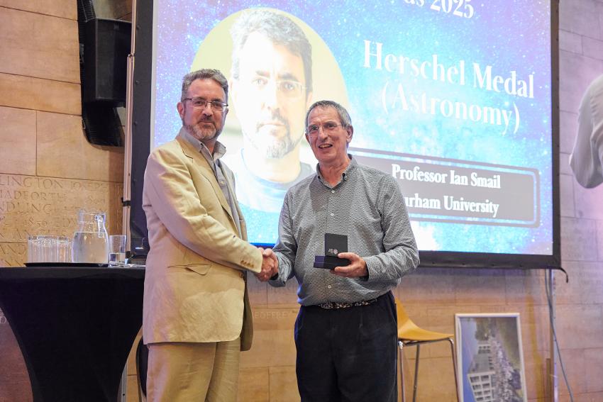 Emeritus Professor Ian Smail, of Durham University, receives the Herschel Medal (A) from RAS president Professor Mike Lockwood.