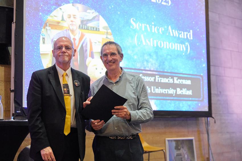 Professor Francis Keenan, of Queen's University Belfast, receives the Service Award (A) from RAS president Professor Mike Lockwood.