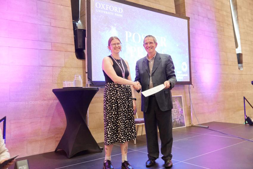 Rebecca Houghton receives the RAS Post Doc Prize runner up certificate for her poster titled 'Searching for low-mass protostars in the Central Molecular Zone with JWST'.