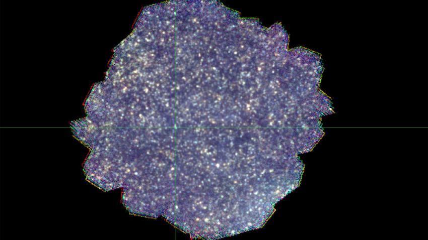 The final SPIRE Dark Field image map created by combining the Blue (250 micrometres), Green (350 micrometres) and Red (500 micrometres) SPIRE camera channels together, each channel stacking a total of 141 individual images on top of each other.