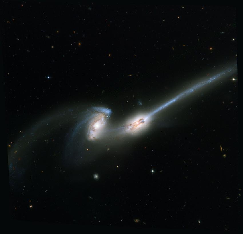 colliding galaxies that are streaming stars and gas